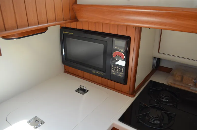 Fleur De Lys Yacht Photos Pics 1986 Hans Christian Christina yacht kitchen with microwave and stove.