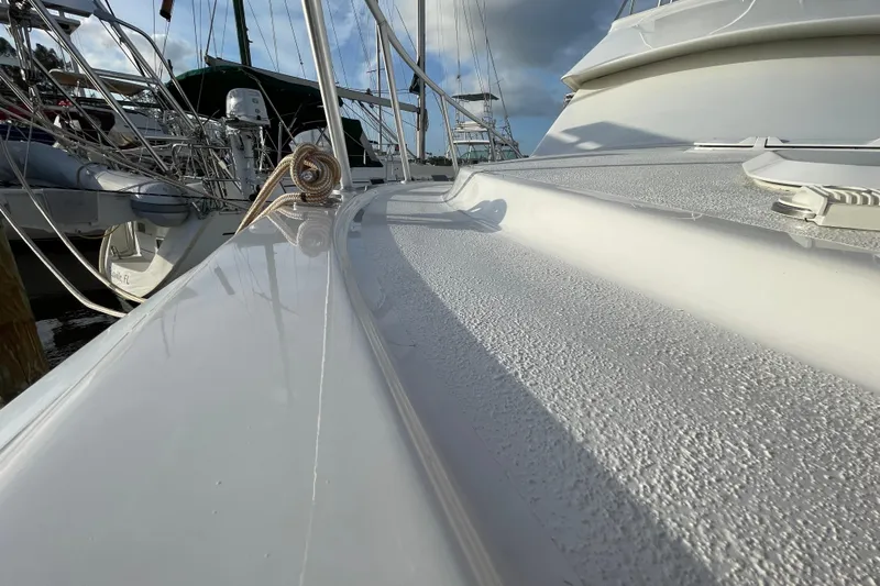  Yacht Photos Pics 2003 Egg Harbor 37 Sport Fisher boat deck with mooring lines, docked at marina.