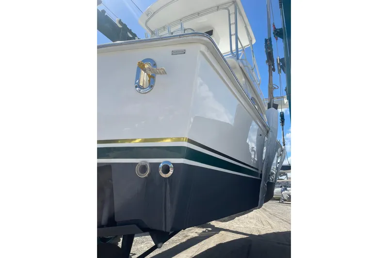  Yacht Photos Pics 2003 Egg Harbor 37 Sport Fisher boat in dry dock, side view.