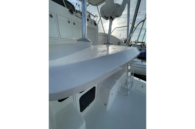  Yacht Photos Pics 2003 Egg Harbor 37 Sport Fisher boat deck with seating and storage.