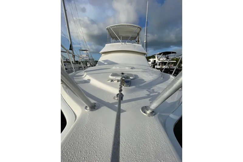  Yacht Photos Pics 2003 Egg Harbor 37 Sport Fisher yacht deck with clear sky and marina view.