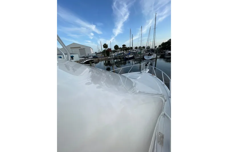  Yacht Photos Pics 2003 Egg Harbor 37 Sport Fisher docked at marina under blue sky.