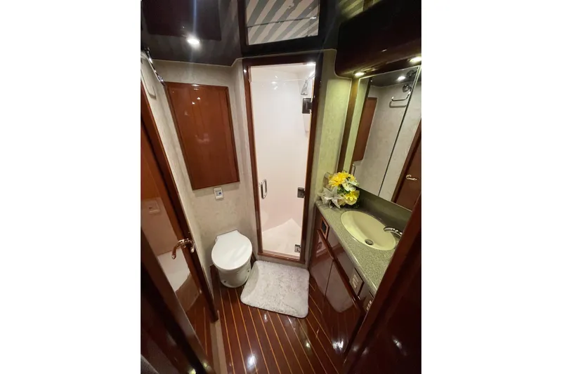  Yacht Photos Pics Luxurious bathroom in 2003 Egg Harbor 37 Sport Fisher yacht with modern amenities.