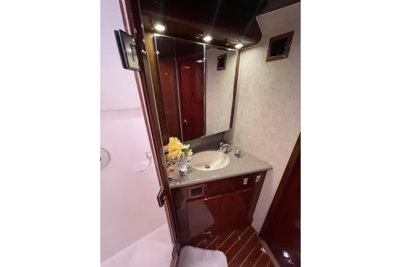  Yacht Photos Pics Luxurious bathroom interior of 2003 Egg Harbor 37 Sport Fisher yacht with elegant wood finishes.