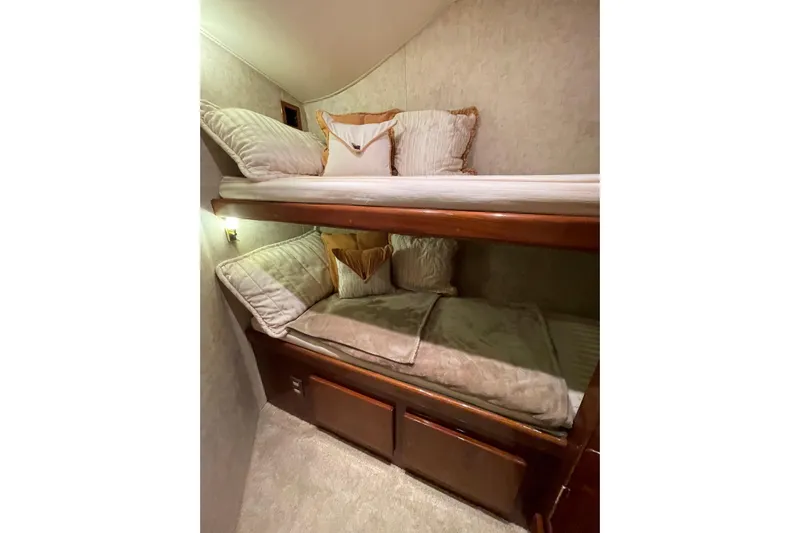  Yacht Photos Pics Interior of 2003 Egg Harbor 37 Sport Fisher with cozy bunk beds and plush pillows.