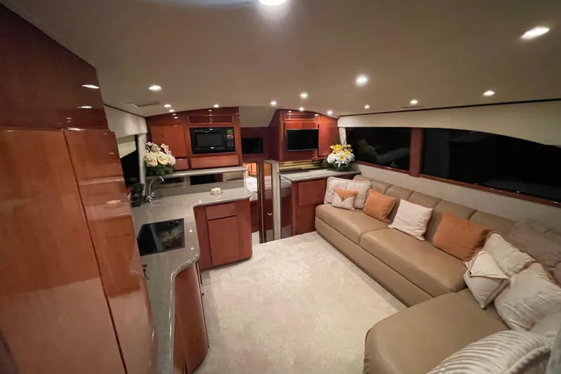  Yacht Photos Pics Luxurious interior of 2003 Egg Harbor 37 Sport Fisher with modern kitchen and cozy seating.