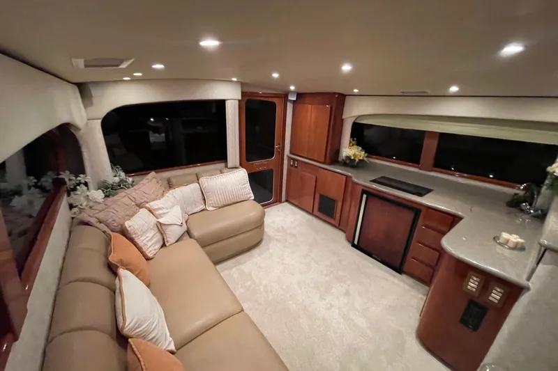  Yacht Photos Pics Luxurious interior of 2003 Egg Harbor 37 Sport Fisher yacht with plush seating and modern amenities.