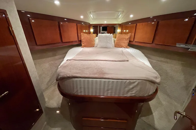  Yacht Photos Pics Luxurious cabin interior of 2003 Egg Harbor 37 Sport Fisher yacht with cozy bedding.