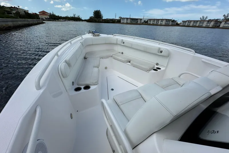  Yacht Photos Pics 2015 Everglades 295 Center Console boat with spacious seating on calm water.