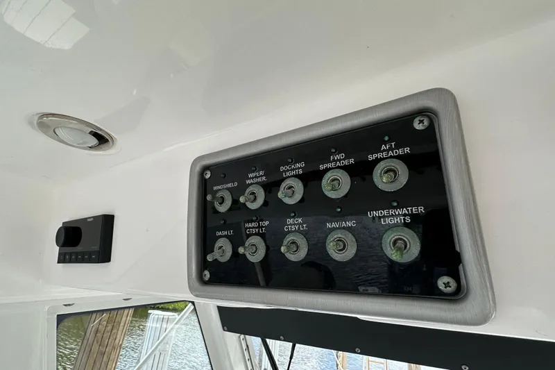  Yacht Photos Pics Control panel of a 2015 Everglades 295 Center Console boat with labeled switches.