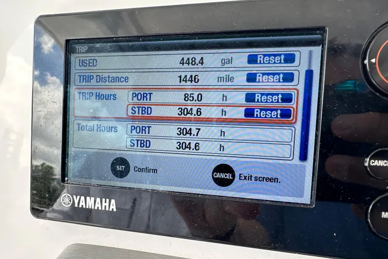  Yacht Photos Pics Display screen of a 2015 Everglades 295 Center Console showing trip data and engine hours.