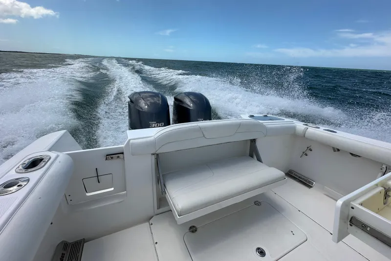  Yacht Photos Pics 2015 Everglades 295 Center Console boat cruising on open water with twin engines.