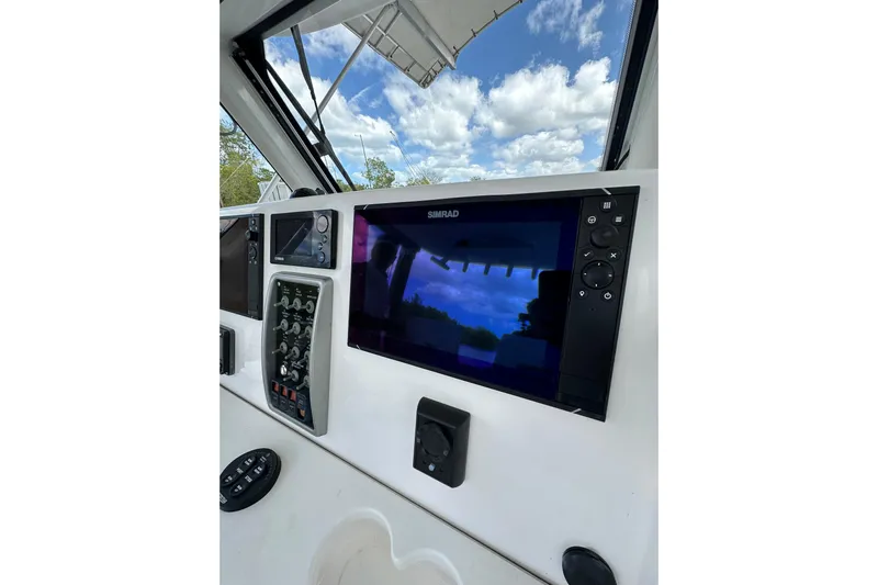  Yacht Photos Pics Control panel of 2015 Everglades 295 Center Console boat with navigation display.