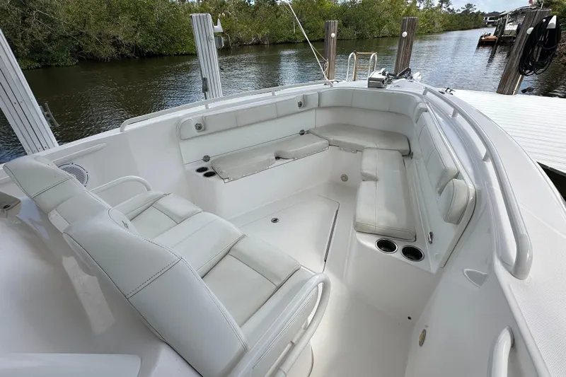  Yacht Photos Pics 2015 Everglades 295 Center Console boat interior with white seating and cup holders.