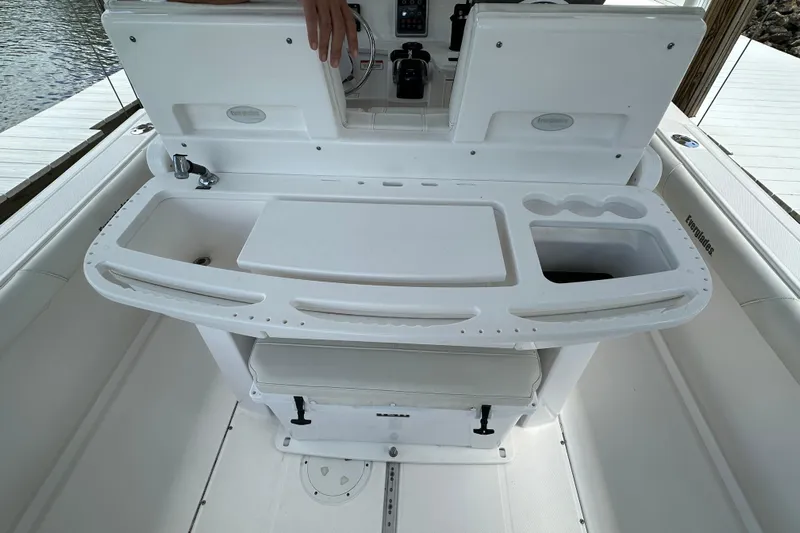  Yacht Photos Pics 2015 Everglades 295 Center Console boat interior with fishing station and storage compartments.