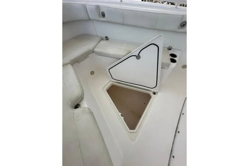  Yacht Photos Pics 2015 Everglades 295 Center Console boat interior with open storage compartment.