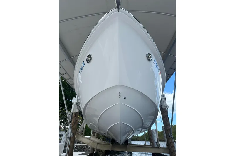  Yacht Photos Pics 2015 Everglades 295 Center Console boat on lift, viewed from below.