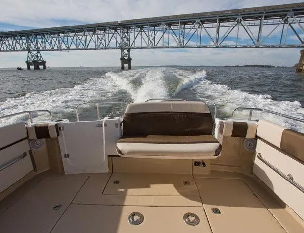 Sal-taire Yacht Photos Pics Manufacturer Provided Image: 2016 Ranger Tugs R-29S boat cruising under a bridge on open water.