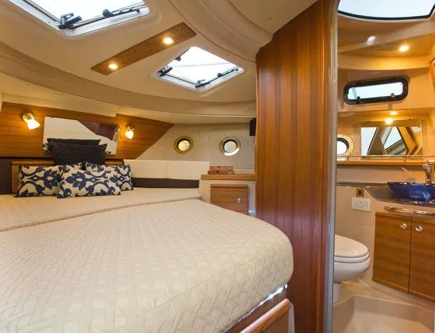  Yacht Photos Pics Manufacturer Provided Image: Luxurious interior of 2025 Ranger Tugs R-29 S with elegant wood finishes and modern amenities.