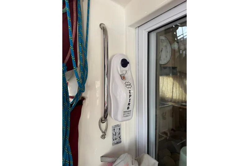 Manila Spirit Yacht Photos Pics EPIRB device mounted on a wall inside a 2012 Dean 5000 boat.