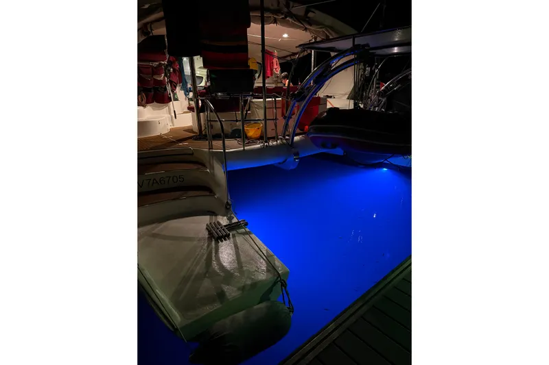 Manila Spirit Yacht Photos Pics Catamaran with blue underwater lights, Dean 5000 model, 2012, docked at night.