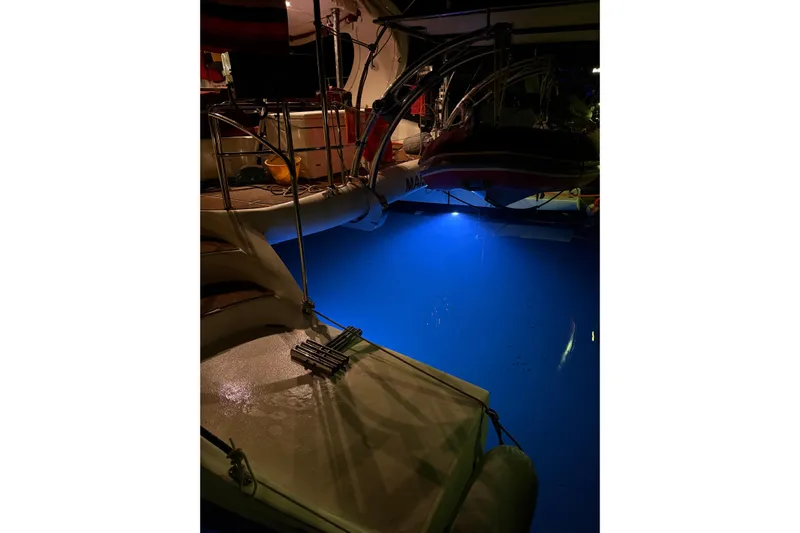 Manila Spirit Yacht Photos Pics Catamaran deck at night with blue underwater lights, Dean 5000, 2012 model.