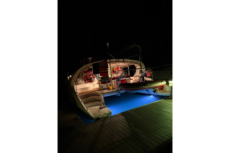 Manila Spirit Yacht Photos Pics Illuminated Dean 5000 yacht at night, docked with blue underwater lights, 2012 model.