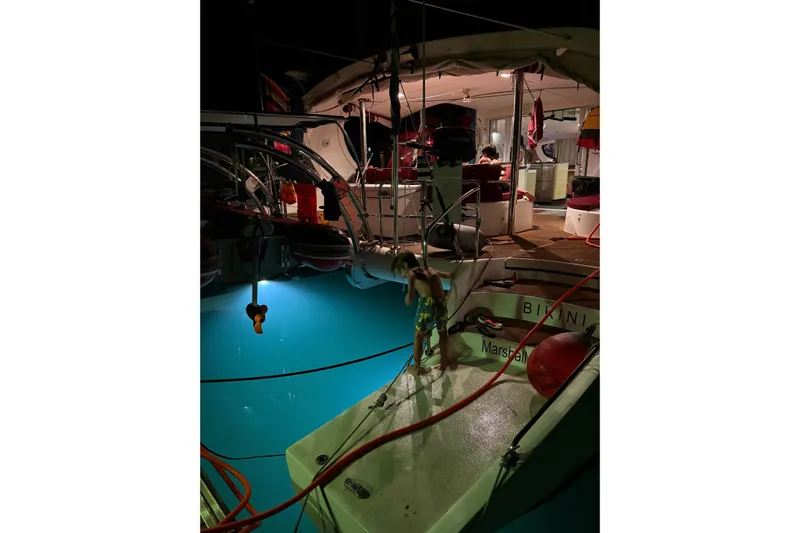 Manila Spirit Yacht Photos Pics Child on yacht at night, illuminated water, Dean 5000, 2012 model.