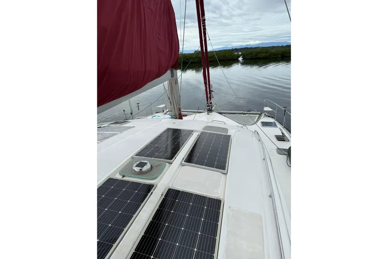 Manila Spirit Yacht Photos Pics Sailboat with solar panels on deck, Dean 5000 model, 2012, on calm water.