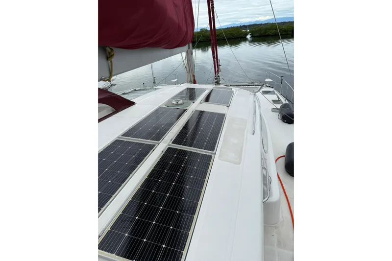 Manila Spirit Yacht Photos Pics Sailboat deck with solar panels, Dean 5000 model, 2012, on calm water.