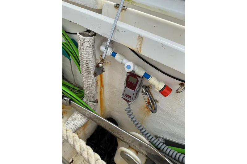 Manila Spirit Yacht Photos Pics Boat interior with Dean 5000 equipment, showing pipes, cables, and a digital device.