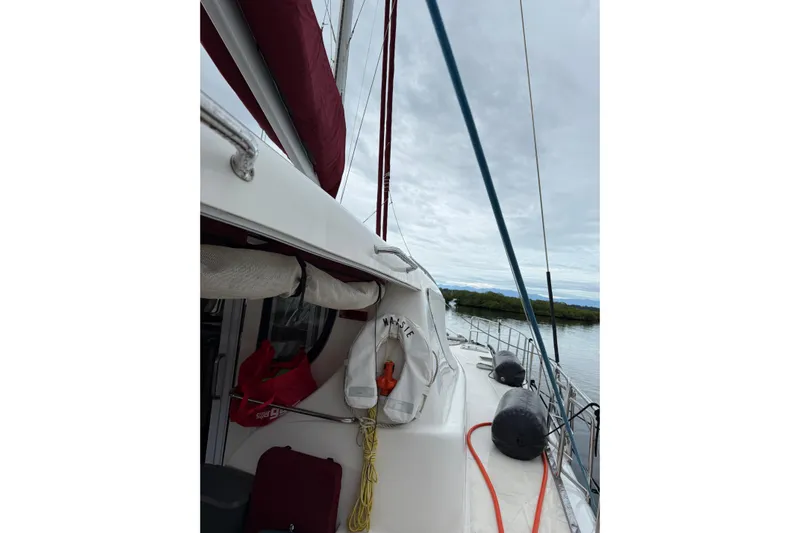 Manila Spirit Yacht Photos Pics Sailboat deck view, Dean 5000 model, 2012, with life preserver and ropes.