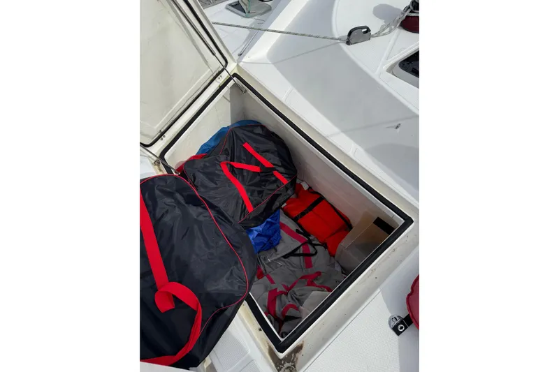 Manila Spirit Yacht Photos Pics Storage compartment on a 2012 Dean 5000 boat with bags and life jackets.