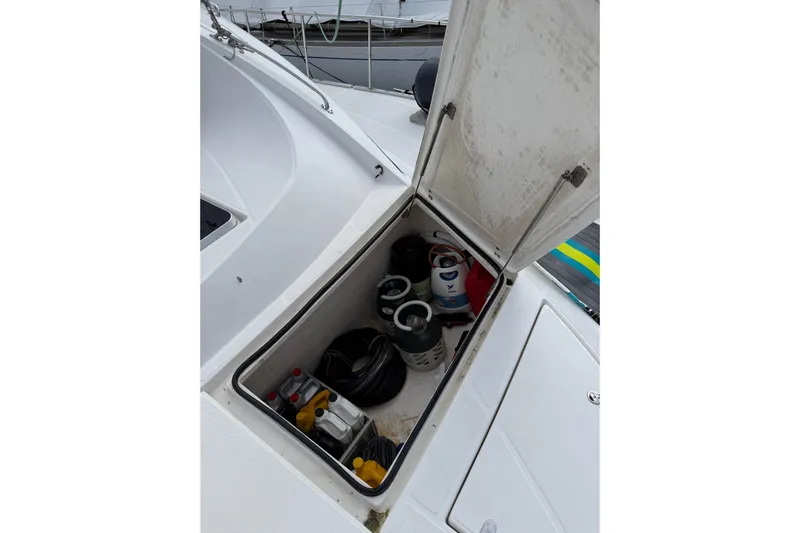 Manila Spirit Yacht Photos Pics Open storage compartment on 2012 Dean 5000 boat deck with equipment inside.