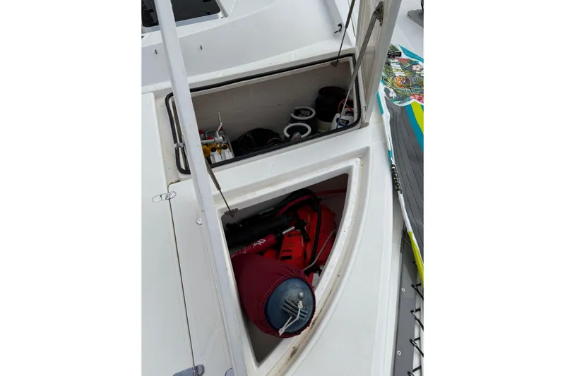 Manila Spirit Yacht Photos Pics Open storage compartment on 2012 Dean 5000 boat with equipment and supplies.
