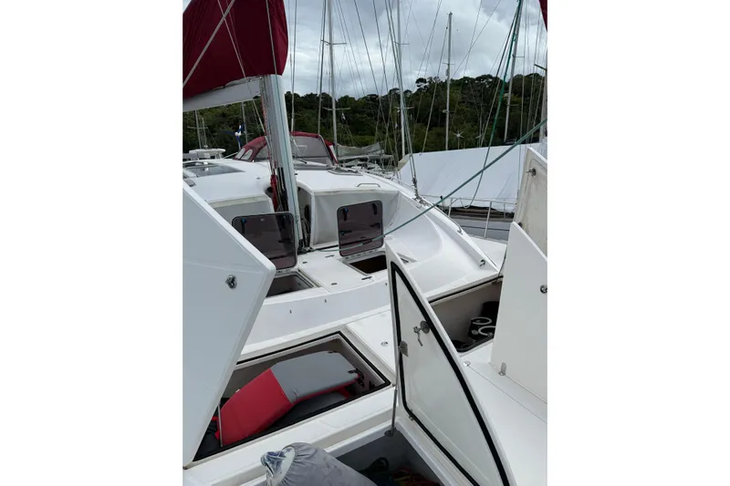 Manila Spirit Yacht Photos Pics Sailboat deck with open hatches, Dean 5000 model, 2012, featuring red sails.