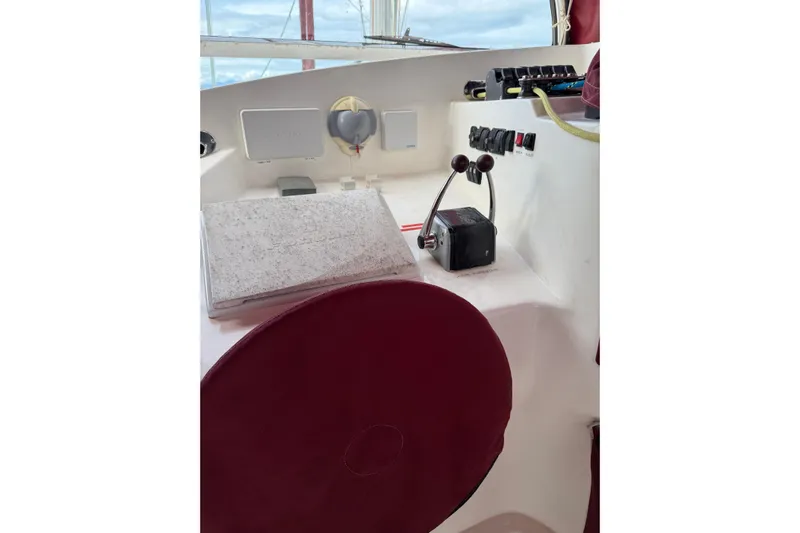 Manila Spirit Yacht Photos Pics Control panel of a 2012 Dean 5000 boat with maroon seat and navigation equipment.