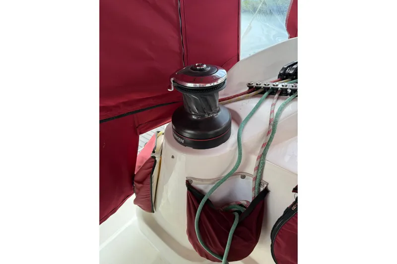 Manila Spirit Yacht Photos Pics Sailboat winch with ropes on a 2012 Dean 5000, featuring maroon canvas covers.
