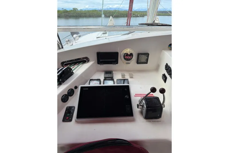 Manila Spirit Yacht Photos Pics Control panel of a 2012 Dean 5000 yacht with navigation instruments and throttle levers.