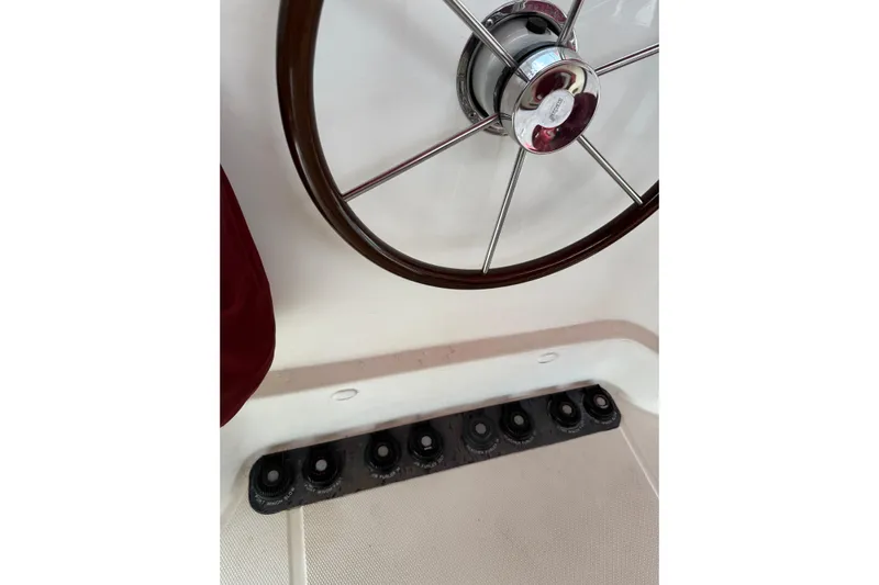 Manila Spirit Yacht Photos Pics Steering wheel of 2012 Dean 5000 boat with control panel below.