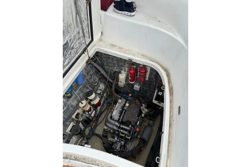 Manila Spirit Yacht Photos Pics Engine compartment of a 2012 Dean 5000 boat, showing mechanical components and fire extinguishers.