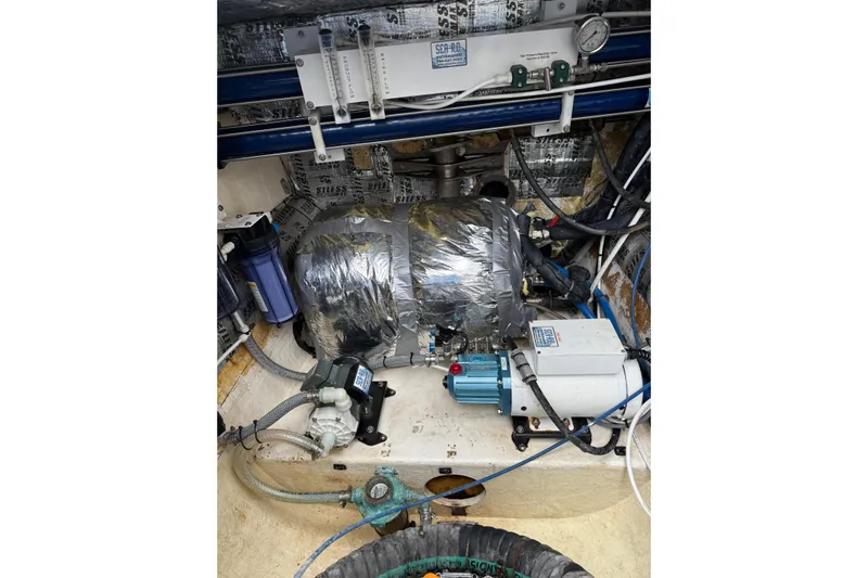 Manila Spirit Yacht Photos Pics Engine room of a 2012 Dean 5000 yacht with mechanical equipment and wiring.