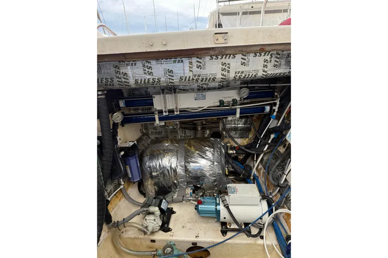 Manila Spirit Yacht Photos Pics Engine compartment of a 2012 Dean 5000 boat with insulation and mechanical components.