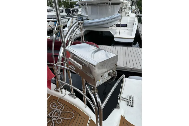 Manila Spirit Yacht Photos Pics Stainless steel grill on a 2012 Dean 5000 yacht, docked at a marina.