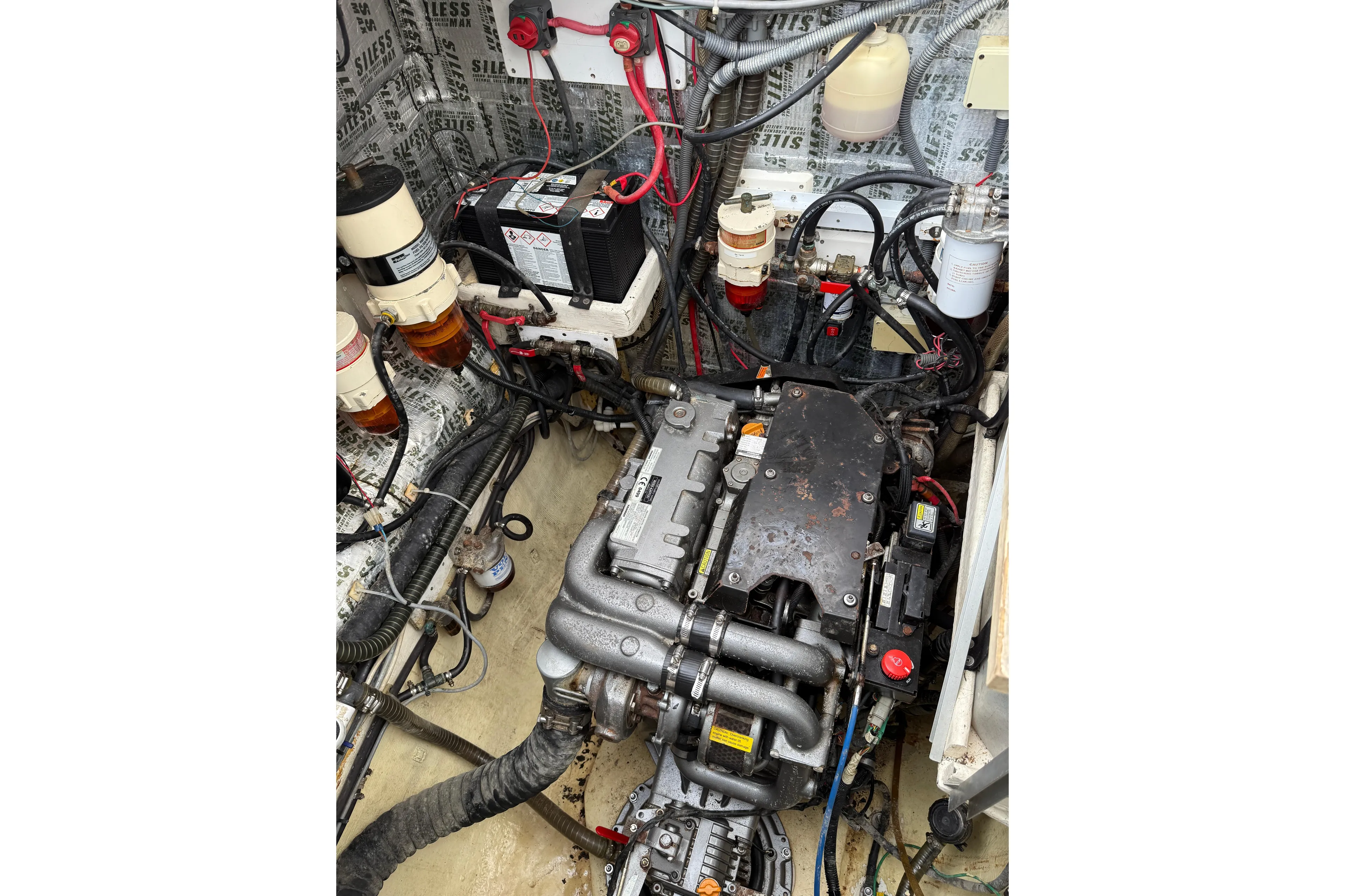 Manila Spirit Yacht Photos Pics Engine compartment of a 2012 Dean 5000, showcasing wiring and components.