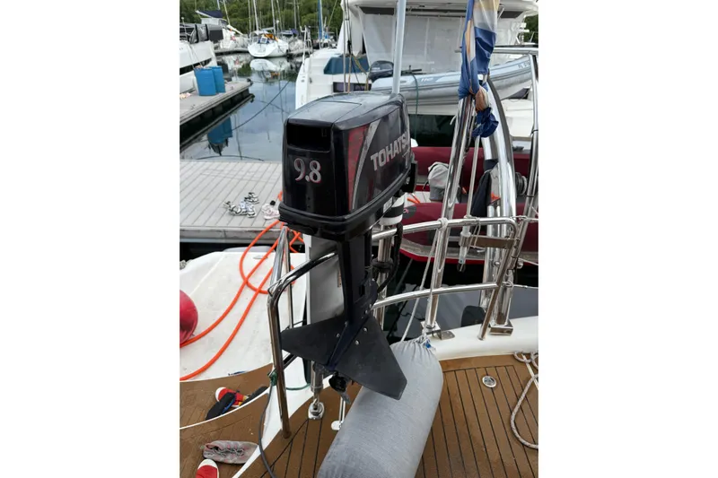 Manila Spirit Yacht Photos Pics Outboard motor on a boat docked at a marina, featuring a Tohatsu 9.8 engine.