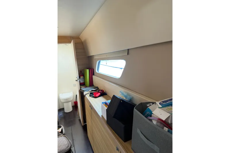 Manila Spirit Yacht Photos Pics Interior of 2012 Dean 5000 yacht with storage and window view.