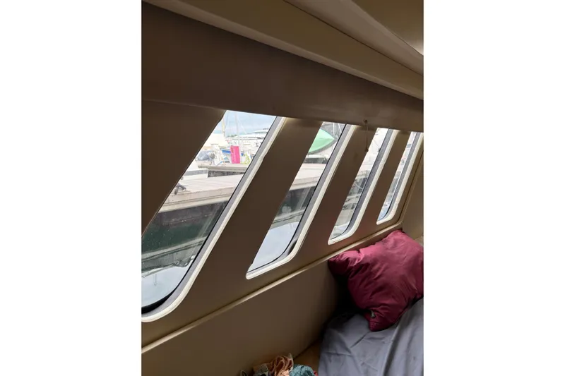 Manila Spirit Yacht Photos Pics Interior view of a 2012 Dean 5000 yacht with marina through windows.