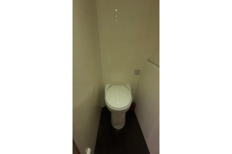 Manila Spirit Yacht Photos Pics Compact bathroom with a white toilet, Dean 5000 model, 2012.