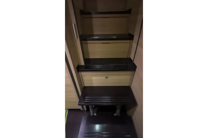 Manila Spirit Yacht Photos Pics Dark wooden steps inside a Dean 5000 model, 2012 interior.